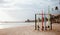 Four colorful surfboards standing on the sandy wide beach prepared for renting service, Weligama, Sri Lanka