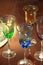 Four colorful toasting glasses