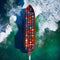 Four container ships sail across the ocean in this aerial photograph, carrying goods and cargo to ports around the world