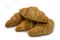 Four Crispy Brown Croissants on a white Background