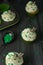 Four cupcakes in green paper