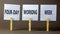 Four-day working week symbol. Concept words Four-day working week on white paper on a beautiful grey table grey background.