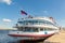 Four-deck river cruise liner `Semyon Budenny` at the pier in the city of Samara