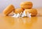 Four delicate yellow macaroons with white flowers with copy space