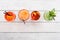 Four different Cocktails with ice ,soda, orange, mint, lime on wooden background top view