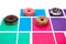 Four different donuts on multicolored background