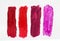 Four different shades of lipstick,