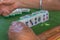 Four elderly women playing and gambling in mahjong at the countryside of southern China. Focus on