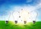 Four electric light bulb on grassland. Eco energy concept.