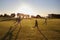 Four elementary school children running in an open field