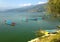Four empty tourist boats on the lake Pheva, mountain view