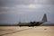 Four-engine propeller cargo plane waiting to take off