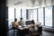 Four female creative colleagues working together in an office, seen through glass wall