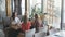 Four female friends enjoying in talking at cafe