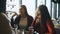 Four female friends enjoying in talking at cafe