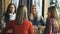 Four female friends enjoying in talking at cafe