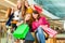 Four female friends shopping in a mall with wheelchair