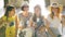 Four Female Tourists with Large Baggage are Sitting in the Waiting Room at the Airport with Passports and Tickets in