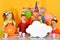 Four festively dressed children are looking at an empty cloud