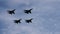 Four fighter jets performing in the air