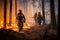 four firefighters walk through a forest with flames