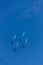 Four flying fighters in the blue sky