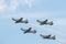 Four flying military aircraft