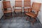 Four folding wooden chairs