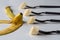 Four forks with banana