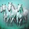 Four free white horses are galloping