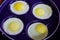 Four frying eggs in a frying pan, healthy diet eating breakfast