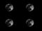 Four full blood moon on black background wallpaper with repeated figures. Black and white picture. Abstract universe, moon, planet