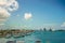 Four giant cruise ships in a row at Nassau port with a lot of yachts foreground. Bahamas