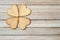 Four gingerbread hearts on a wooden table