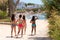 Four girls in bathing suits go to the beach in Sitges, Barcelona, Catalunya, Spain.