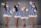Four girls dressed as Snow Maiden celebrate Christmas