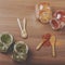 Four glass jar with spices and four wooden spoon on the table