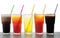 Four glasses of cold, fresh, homemade sodas with ice and drinking straws against a white background. Flavors include orange, rasp
