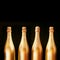 Four gold bottles of luxury champagne