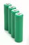 Four green batteries with blank covers