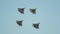 Four green military fighter jets flying in the sky