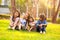 Four happy smiling child playing in park