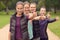 Four Healthy Women in Line Showing Thumbs Up