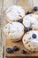 Four homemade fresh muffins with blueberries on rustic wooden table