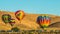 Four Hot Air Balloons Near Parking