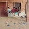 Four Indian childrens swinging swing, enjoying summer holidays