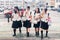 Four Japanese Schoolgirls crossing the street.Heat in the city