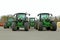 Four John Deere Agricultural Tractors on a Yard