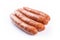 Four juicy fresh sausages isolated on white background. Generative ai