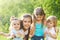 Four kids in the daisy spring field